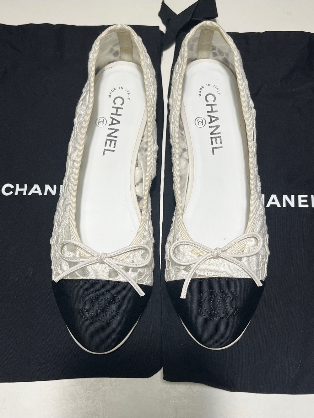 CHANEL Ivory Quilted Ballet Flats with Black Cap Toe